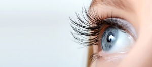 Female eye with long eyelashes close-up listen to your eye
